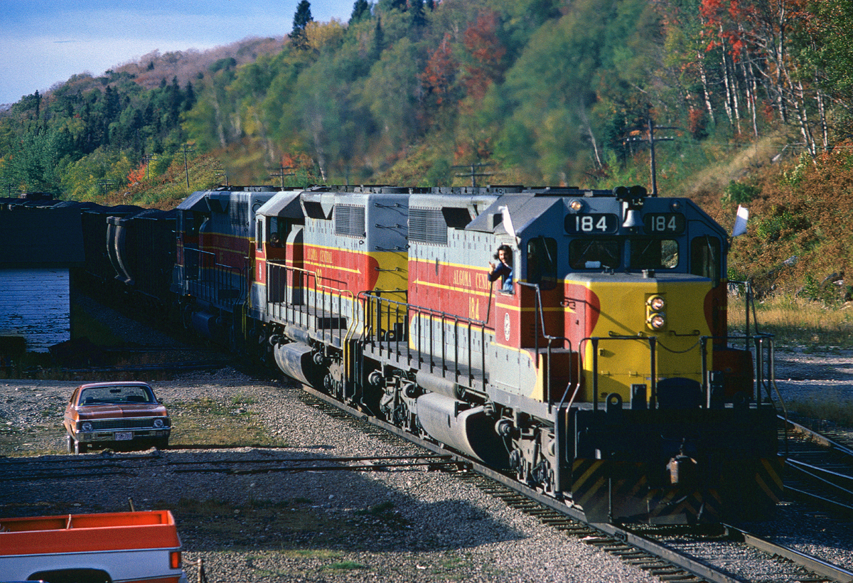 Extra 184 South is at Frater Station as a friendly crew member waves at me. Taken from the roof of the station.
