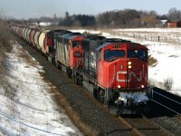 CN 5734 crawls up the grade between Clarke and Newtonville with a unit Potash train