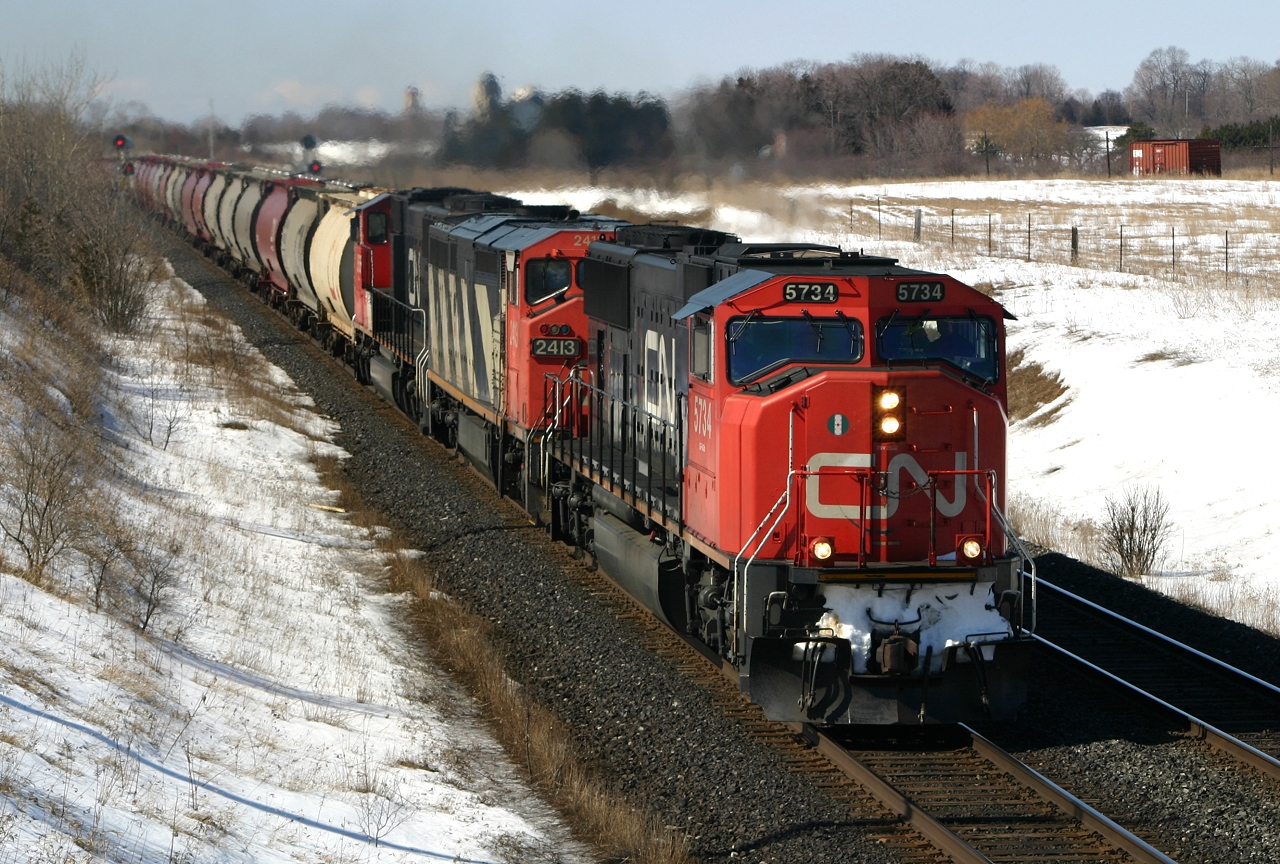 CN 5734 crawls up the grade between Clarke and Newtonville with a unit Potash train