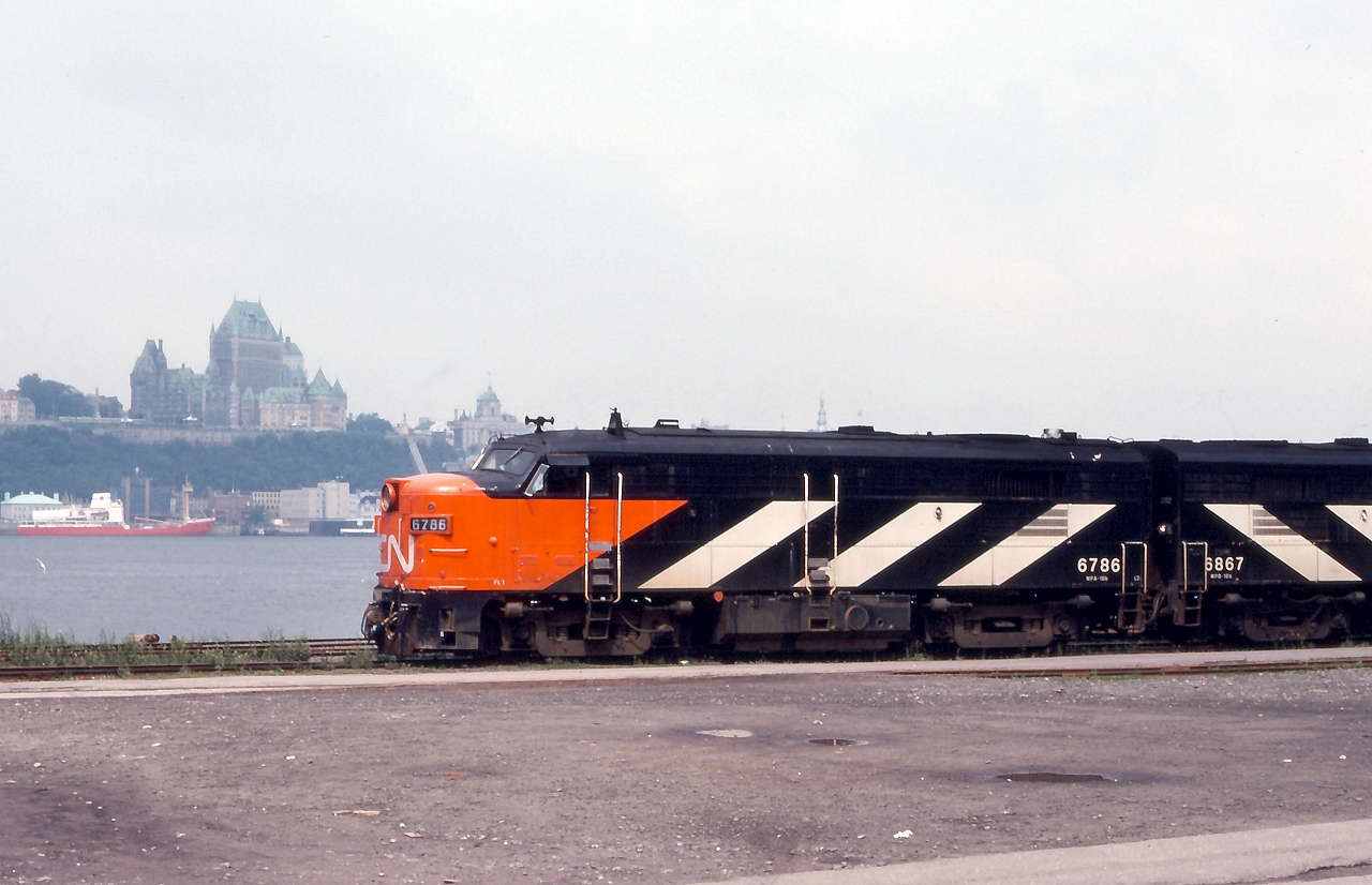 CN #11 makes a station stop at Levis Quebec, across the St. Lawrence River is the Chateau Frontenac, a CPR Hotel.
