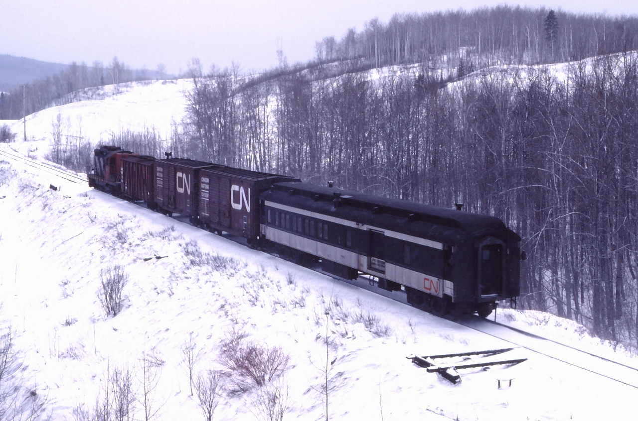 CN combine #7189 brings up the rear of train 278, the mix train between Thunder Bay and Sioux Lookout.  Conmee was the junction between the Kashabowie Sub to Atikokan and the Graham Sub up to The Allanwater Sub a few miles east of Sioux Lookout.
