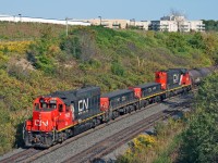 A pair of matching GP38-2's and slugs shove 3,000 ft of connecting traffic for the east crest to get humped at CN's MacMillan Yard. 