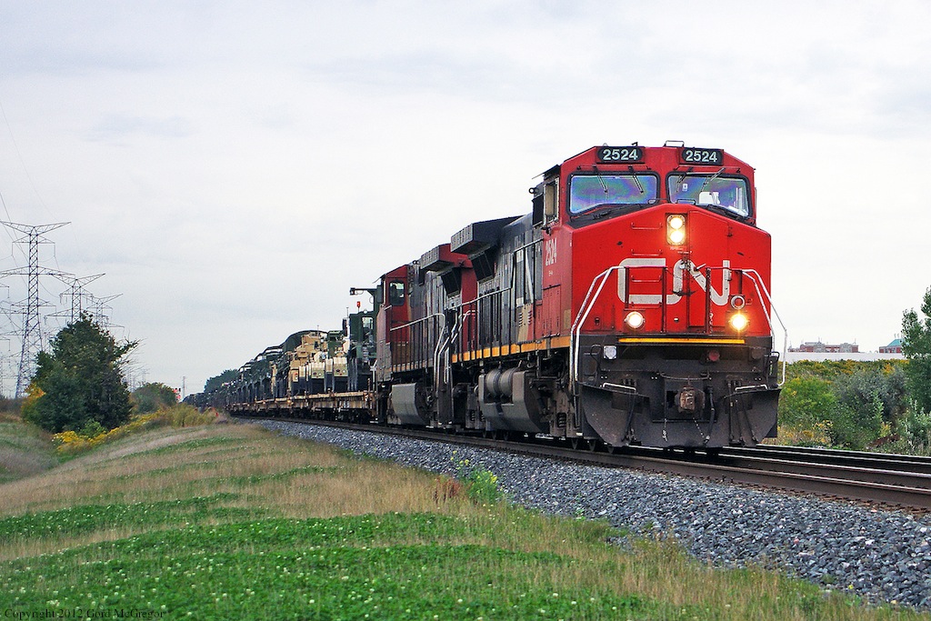 CN 753 military train runs through Hagerman's on its way to a crew change at Doncaster where it will continue on the Bala Sub Northward.