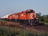 CP 1853, 4243 and a GP9 lead a westbound TOFC train through Cherrywood