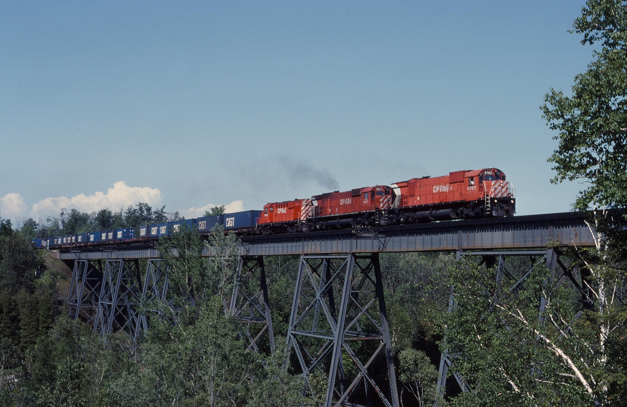 CP 509 crosses the trestle at Cherrywood behind M636 4702, M630 4511 and an RS18u 1828