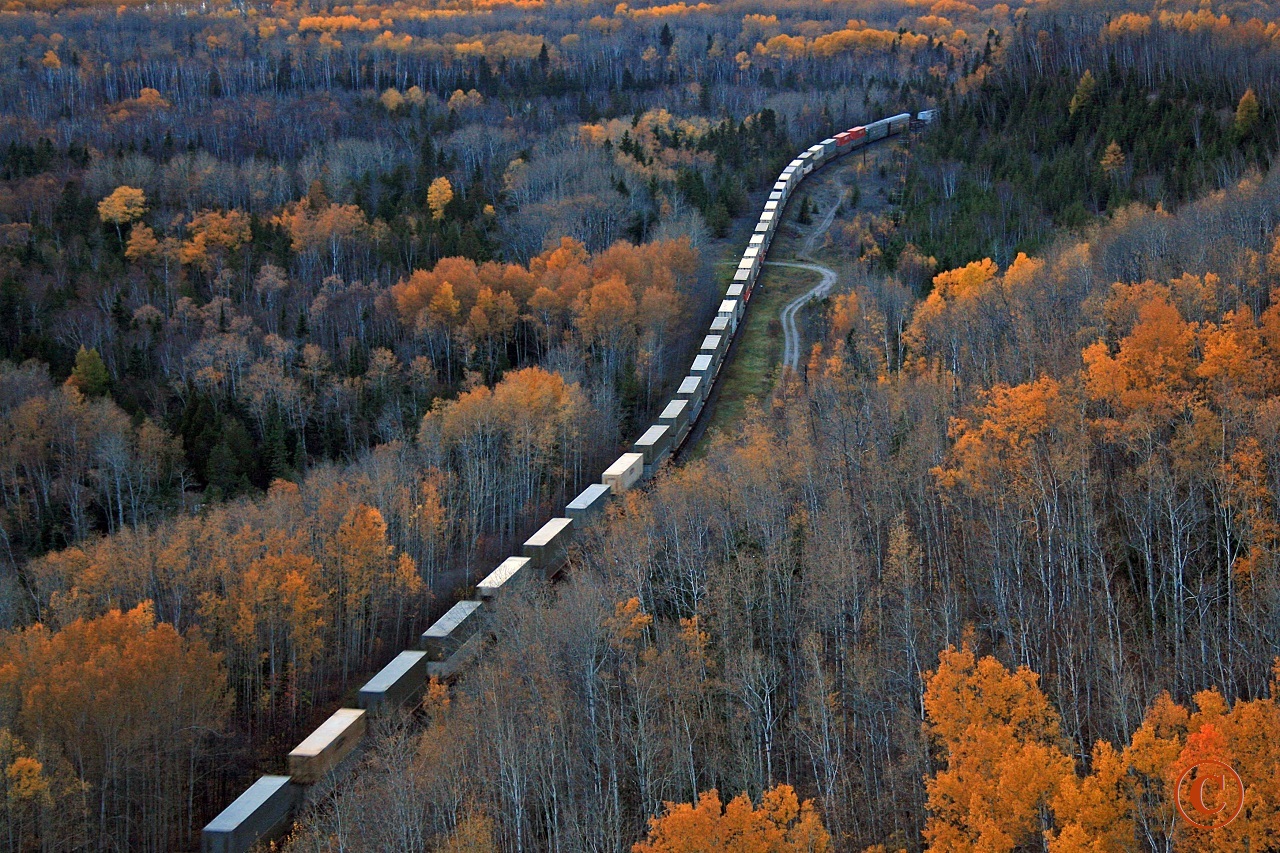 Fading light and the last of the fall colour change across the lowlands of Lake Superior's Kama Bay sees CP 9825 and 9860 roll westward with Toronto to Edmonton train 103 at mile 45.9 on the CP's Nipigon Sub October 9, 2010.