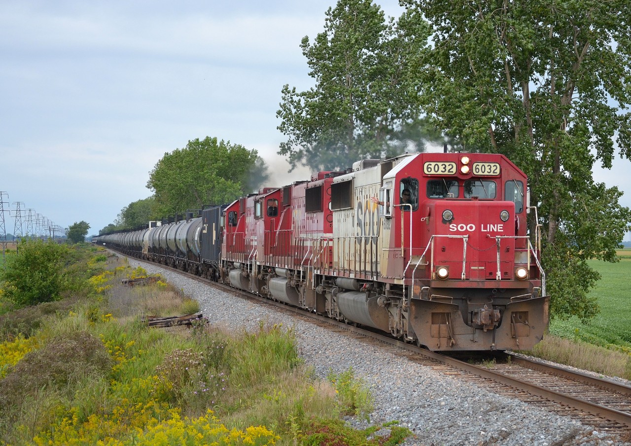 CP 640 a loaded ethanol train with a trio of SOOs leading, passes thru Jeannette with a friendly wave from Dave the engineer.