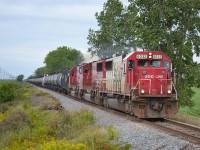CP 640 a loaded ethanol train with a trio of SOOs leading, passes thru Jeannette with a friendly wave from Dave the engineer.