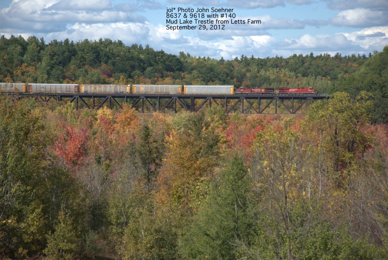 Fall colours changing in the lower swampy area under Mud Lake Trestle.  CP #140 with 8637 & 9618 on Mud Lake Trestle shot from the Letts Farm south of the trestle September 29, 2012