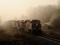 On a chilly fall morning, the fog begin's to lift in the rural town of Flamboro, as CP 8839 North emerges with Toronto bound freight 255. 