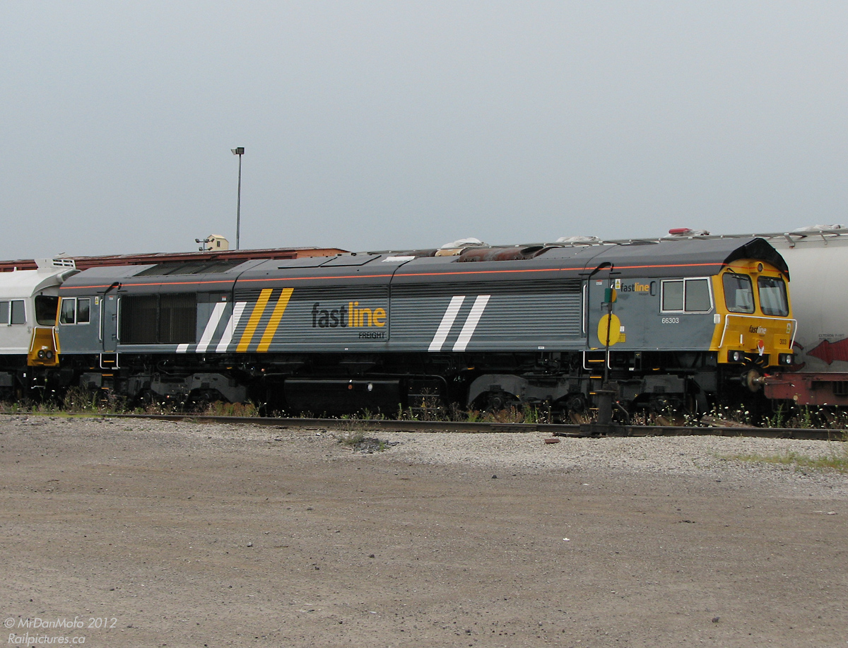 Back when EMD of London ON was the primary plant of Electro-Motive's locomotive manufacturing, they built North American freight units as well as those for foreign railroads overseas. Fastline Freight 66303 is just one of an "Export Special" of 9 Class 66 units (EMD model JT42CWR-T1) sitting inside CN's Mimico Yard in Etobicoke awaiting export to the UK, France and The Netherlands. 66303 would be moved to the Toronto Port Authority, loaded up on the Jumboship MV Daniella, cross the Atlantic Ocean and be unloaded in Newport, UK later that month (*note, photo taken from entranceway on public property looking into yard).