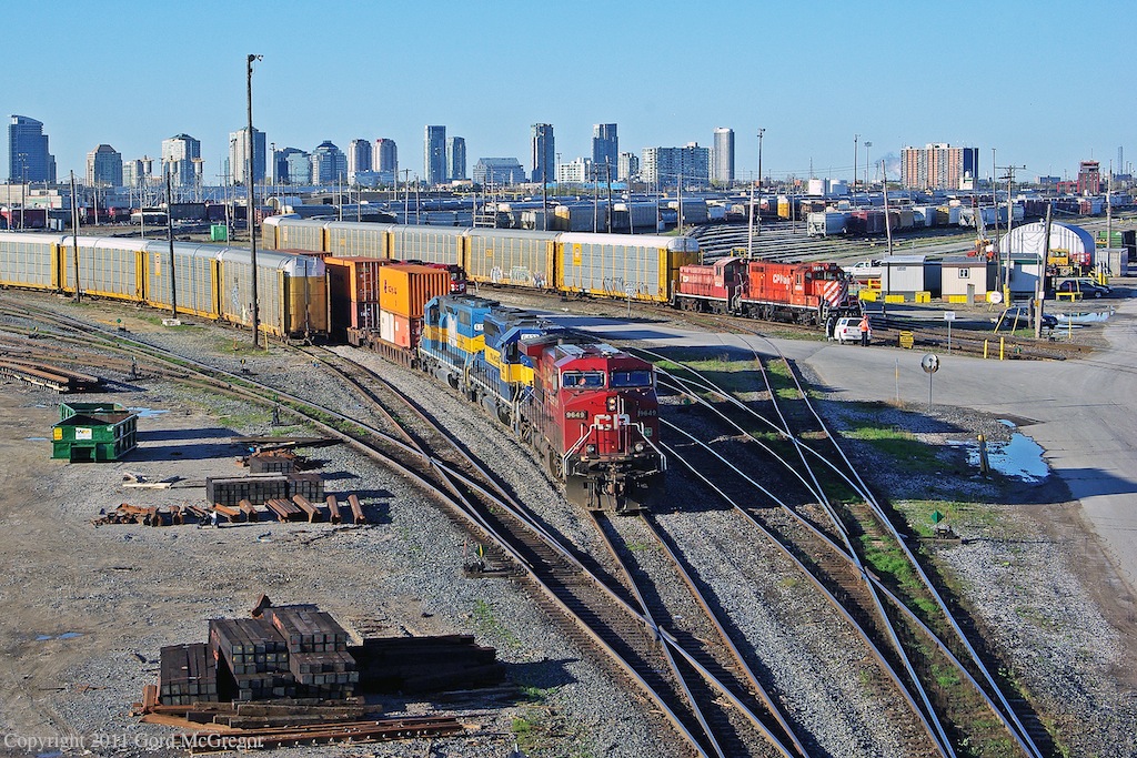 A pair of DM&E units along with 9649 and yard power sit quietly on a Sunday Morning.