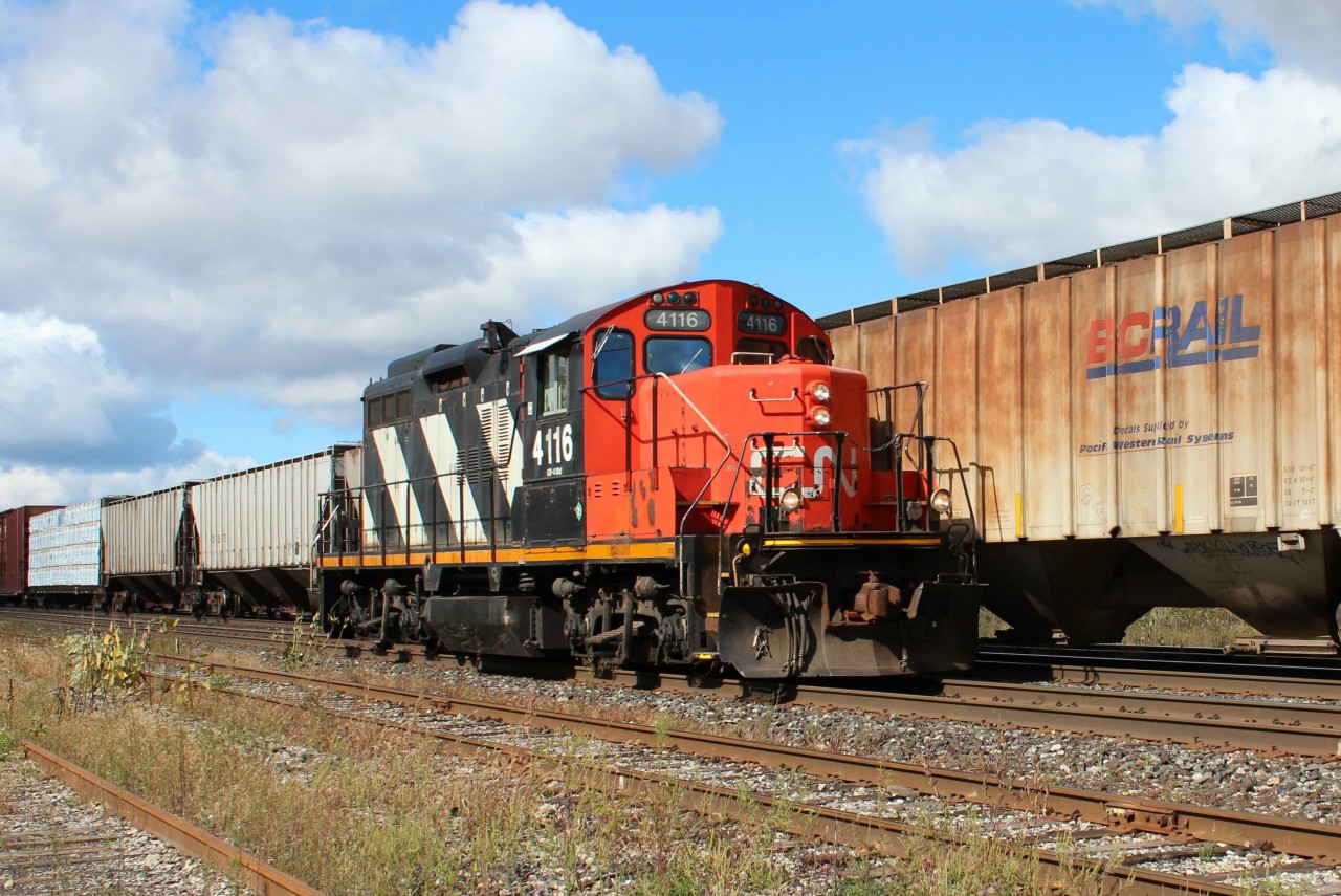 Having helped a wesbound freight to Paris, GP9 RM 4116 has been cut off from the train and is running light to resume her duties as the Brantford yard engine.