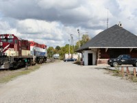 As the crew breaks for lunch inside, OSRX 182 and 644 idle away in front of the old CP Woodstock station, after having set off a number of loaded autoracks from the CAMI plant in Ingersoll.