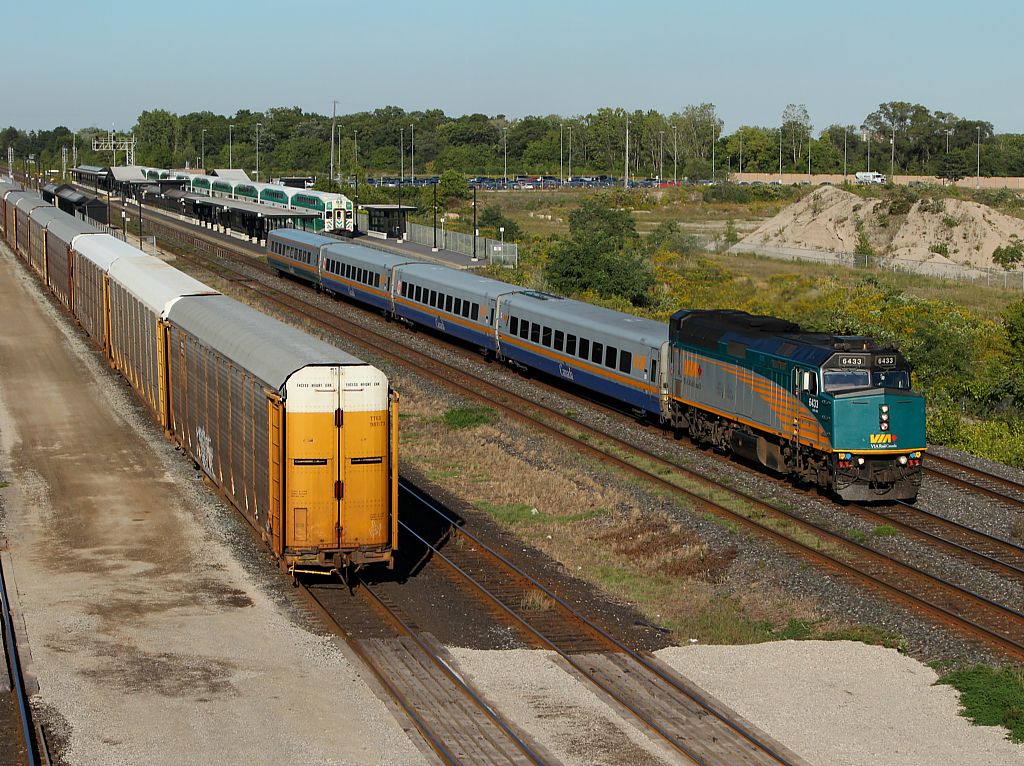 VIA 83 departs Aldershot while an eastbound GO train gets ready to depart for Toronto.