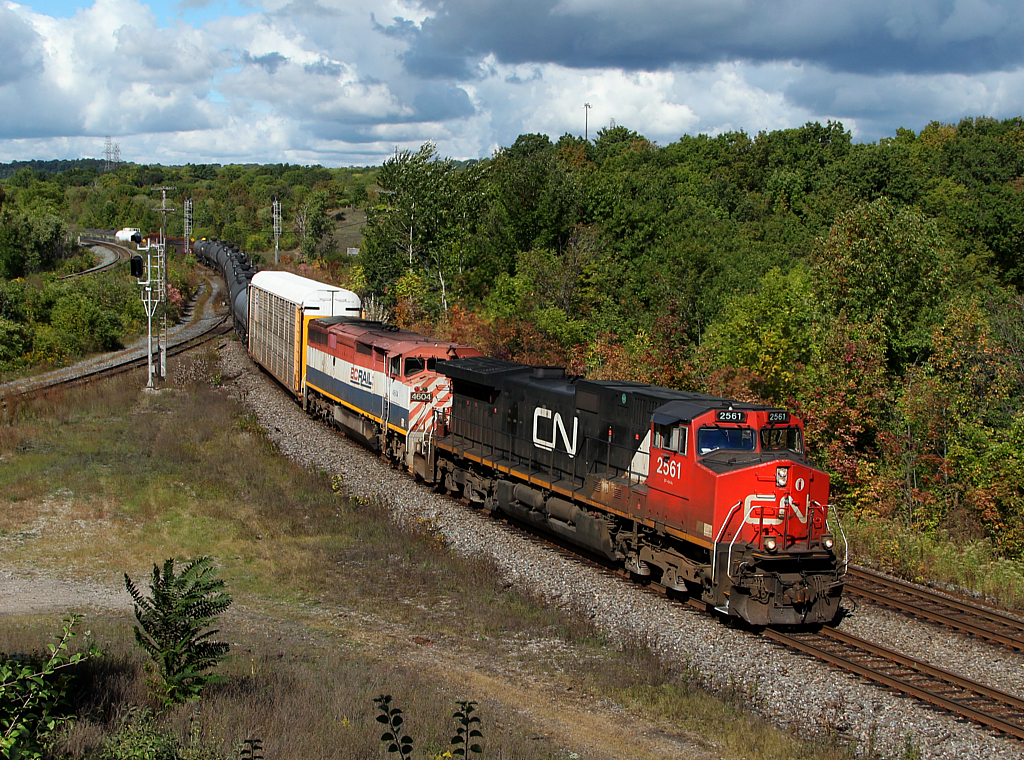 CN 382 passes through Hamilton West with a western visitor trailing.