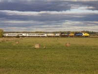 After 35 years of service, another era hath come to an end. Started in 1977, and ended in 2012. This is the last revenue Northlander train and has passed Brechin south for the last time. Due to the divestment of the ONTC, the Ontario Northland's assets are slowly being chipped away to 'fix' the deficit we face in Ontario. Now this is certainly not the most efficient way to deal with it, considering all the other things Queens Park pisses away money on, but at any rate...in this scene P69831 28 races south hornin' for the double crossings at the south end of Brechin.