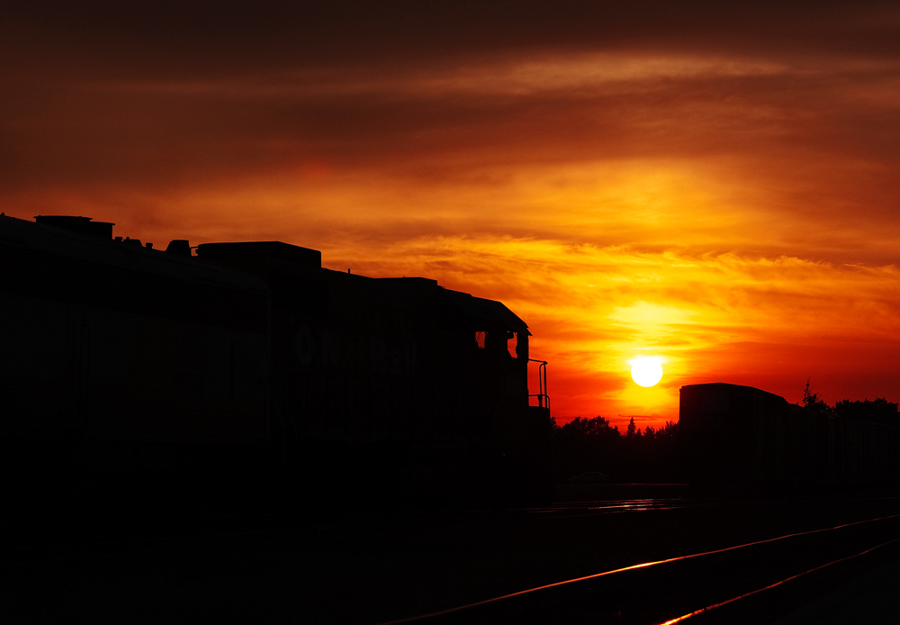 Northern Ontario sunset, ONR 121 arrived into Cochrane 15 minutes ago and is now backing into the yard to be tied up and service for the night for tomorrows run south as 122 to Toronto.