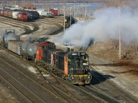 RLK 1201 and 1359, throttle up to kick a cut of cars in the Stuart Street Yard