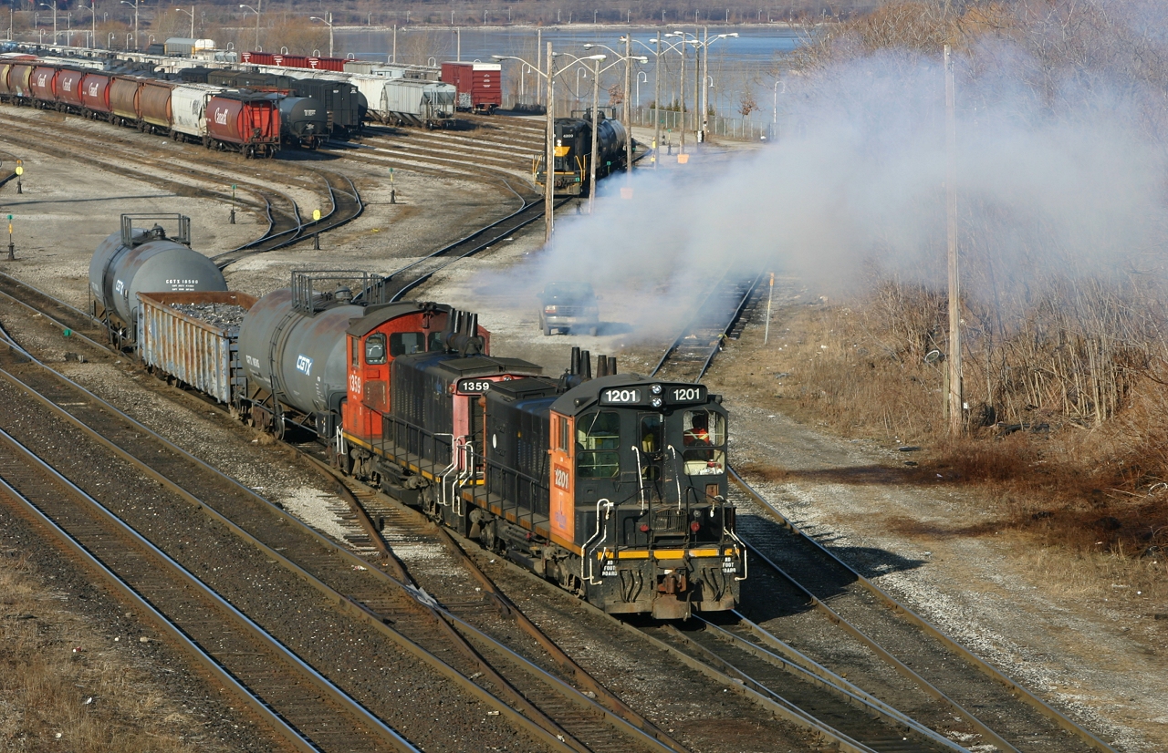 RLK 1201 and 1359, throttle up to kick a cut of cars in the Stuart Street Yard