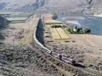 The RMRXW 8015 w/ the 8019 trailing are Vancouver bound along the Thompson River at Walhachin. 0925 hrs. on the 17th.