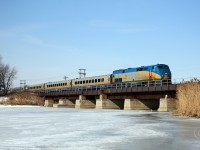 Windsor to Toronto train 72, lead by VIA 910, crosses the Jeannettes Creek bridge at mile 73.9 on the VIA's Chatham Sub March 7, 2010.