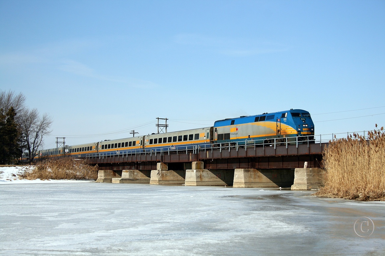Windsor to Toronto train 72, lead by VIA 910, crosses the Jeannettes Creek bridge at mile 73.9 on the VIA's Chatham Sub March 7, 2010.
