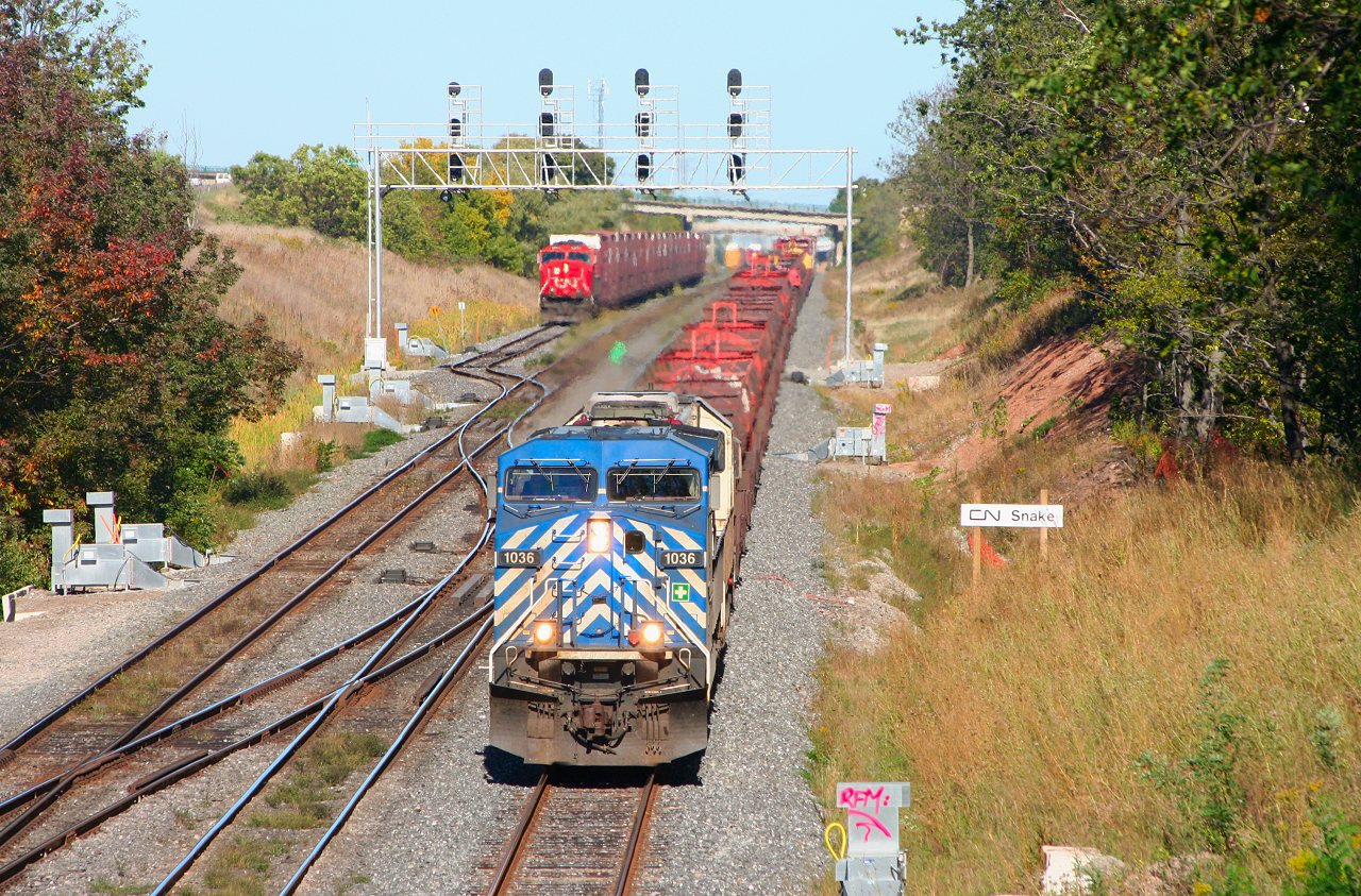A colourful CP 254 cruises through Snake as CN 431 prepares to depart for Buffalo and 435 works the yard.