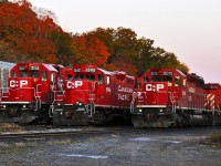 CP 541, TH21 and 426 are lined up at the Kinnear Yard office at sunrise. All three varieties of EMD units sport the newest CP corporate paint scheme.