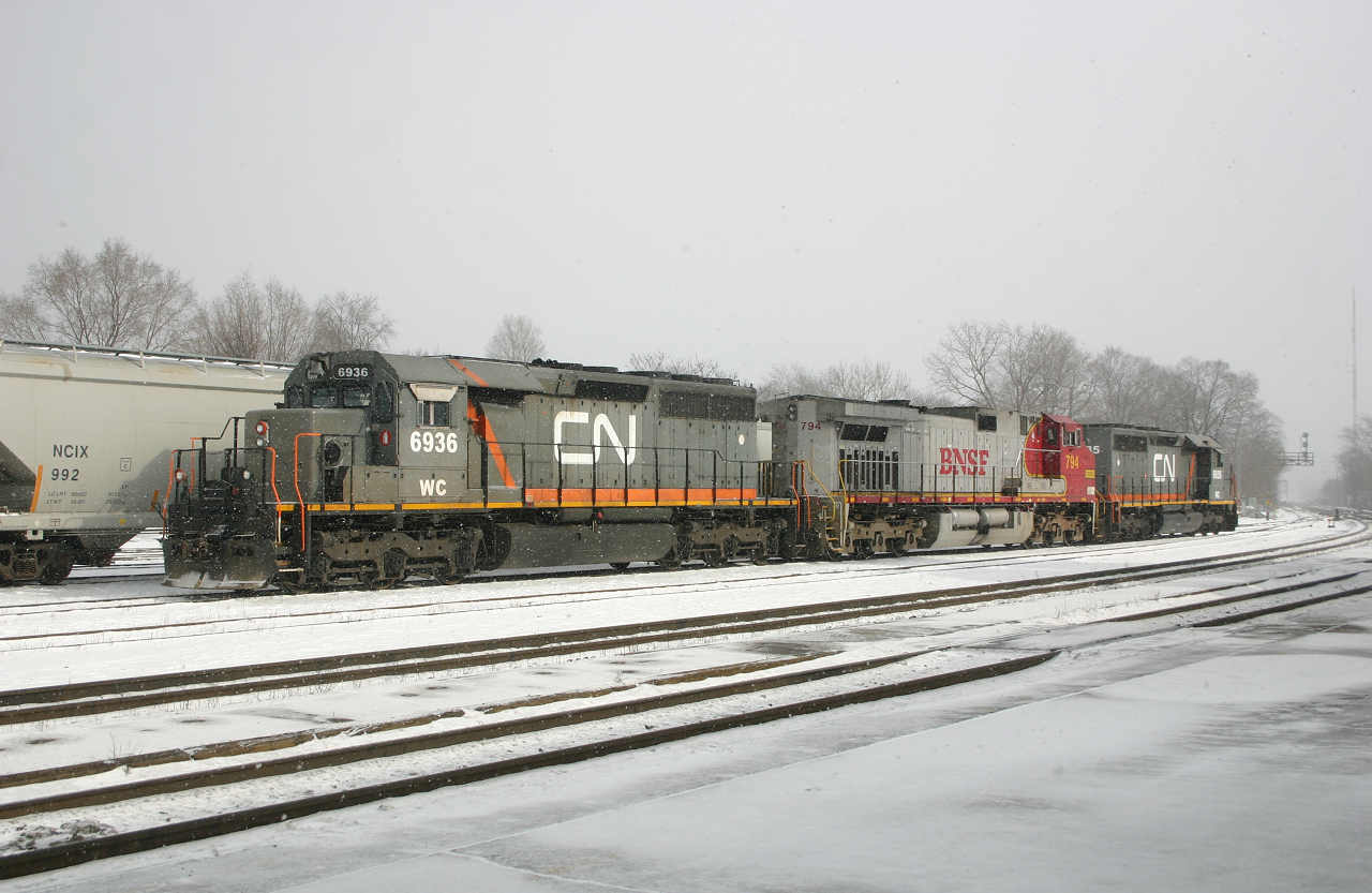 CN 148's power today is WC 6935, BNSF 794 and WC 6936 idle in the yard at Brantford as they figure out which unit to set off for 399, who is sitting at Hardy.  Initially WC 6936 was to be donated, however BNSF bolts their MU cables to their locomotives, thus forcing 148 to give 399 the BNSF 794 - Which, luckily for us would lead westward after wyeing at Bayview!