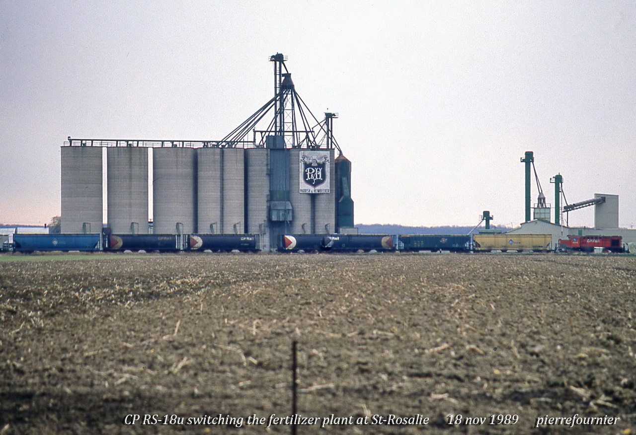 A CP Rs-18u is switching at the local grain mill.