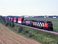CN 208 near HW 55 overpass,that was about the beginning of double stack containers on the Drummond.