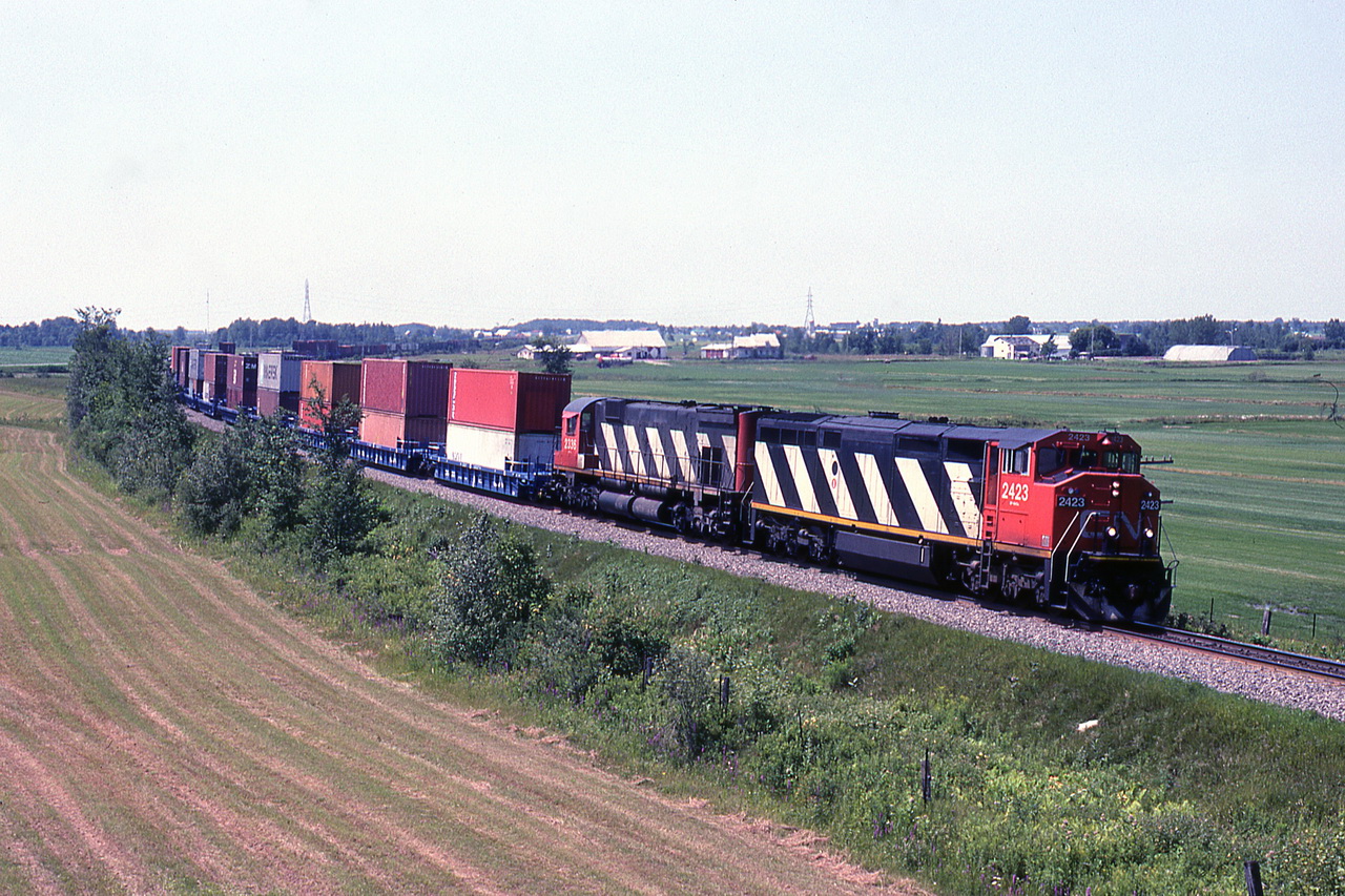 CN 208 near HW 55 overpass,that was about the beginning of double stack containers on the Drummond.
