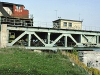 The swing bridge attendant waves the crew of CN 146 as they get on the bridge