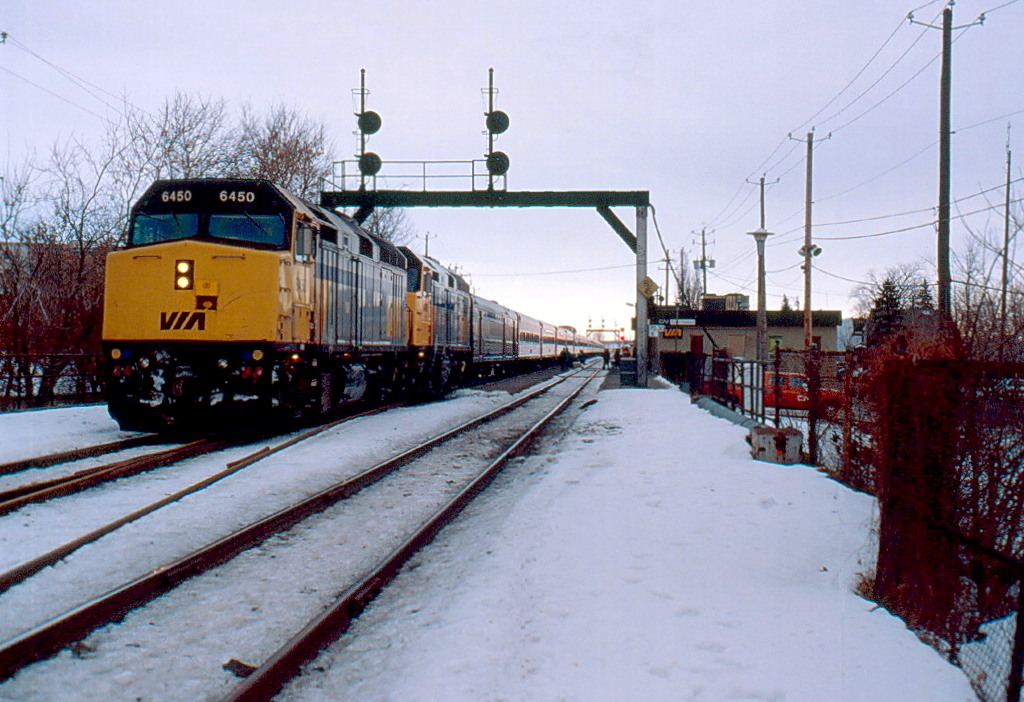 VIA 15 early in the morning with 12 more minutes to Central station,6450 was wrecked in NB in 2000.