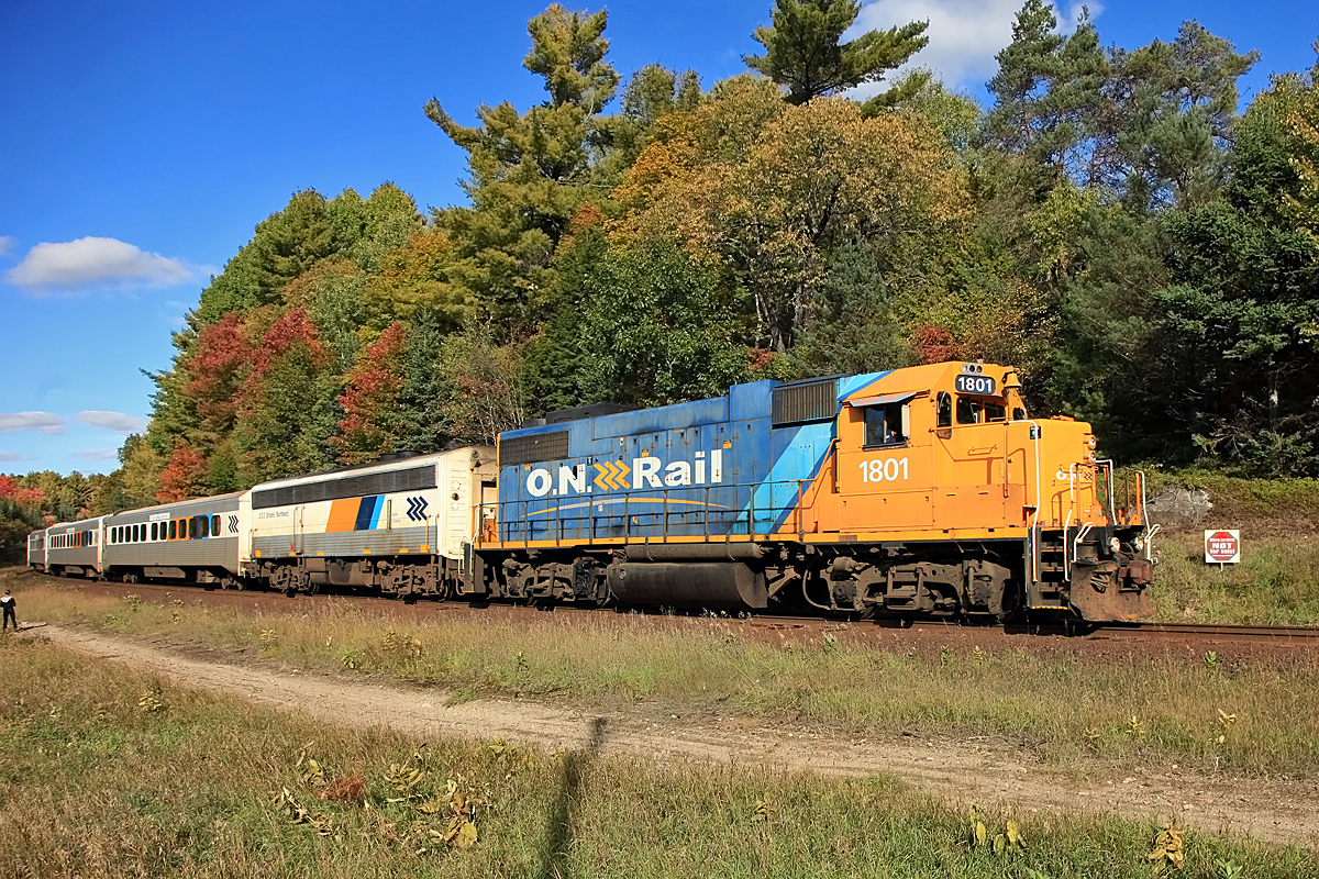 With only one more day of scheduled Northlander train service 1801 is greeted at Utterson by at least  five photographers and a couple of kids taking the long way home from school.