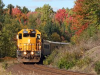 1801 leads the southbound Northlander out of the woods and into the afternoon sunshine on the second last day of scheduled service. 