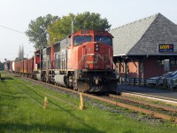 CN 430 later than usual with a short train goes past the station with 5776 trailing.