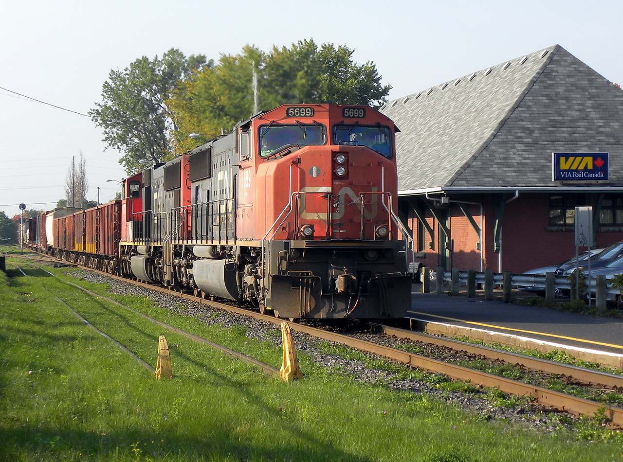 CN 430 later than usual with a short train goes past the station with 5776 trailing.