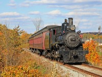 South Simcoe's beautiful ex-CP 4-4-0 Number 136 pushes an extra, made necessary by a high passenger turnout, north to Beeton at the 6th Line just outside Tottenham on a brisk but sunny autumn afternoon.