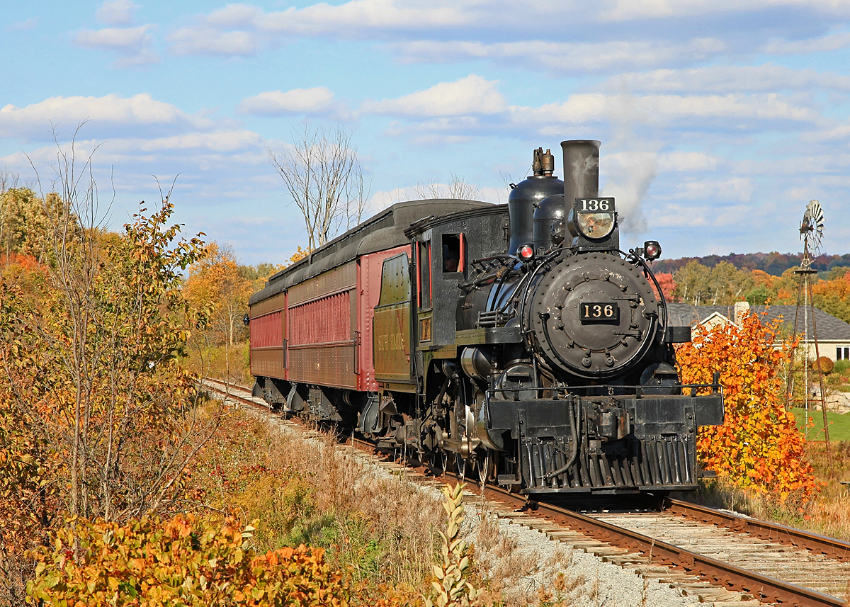 South Simcoe's beautiful ex-CP 4-4-0 Number 136 pushes an extra, made necessary by a high passenger turnout, north to Beeton at the 6th Line just outside Tottenham on a brisk but sunny autumn afternoon.