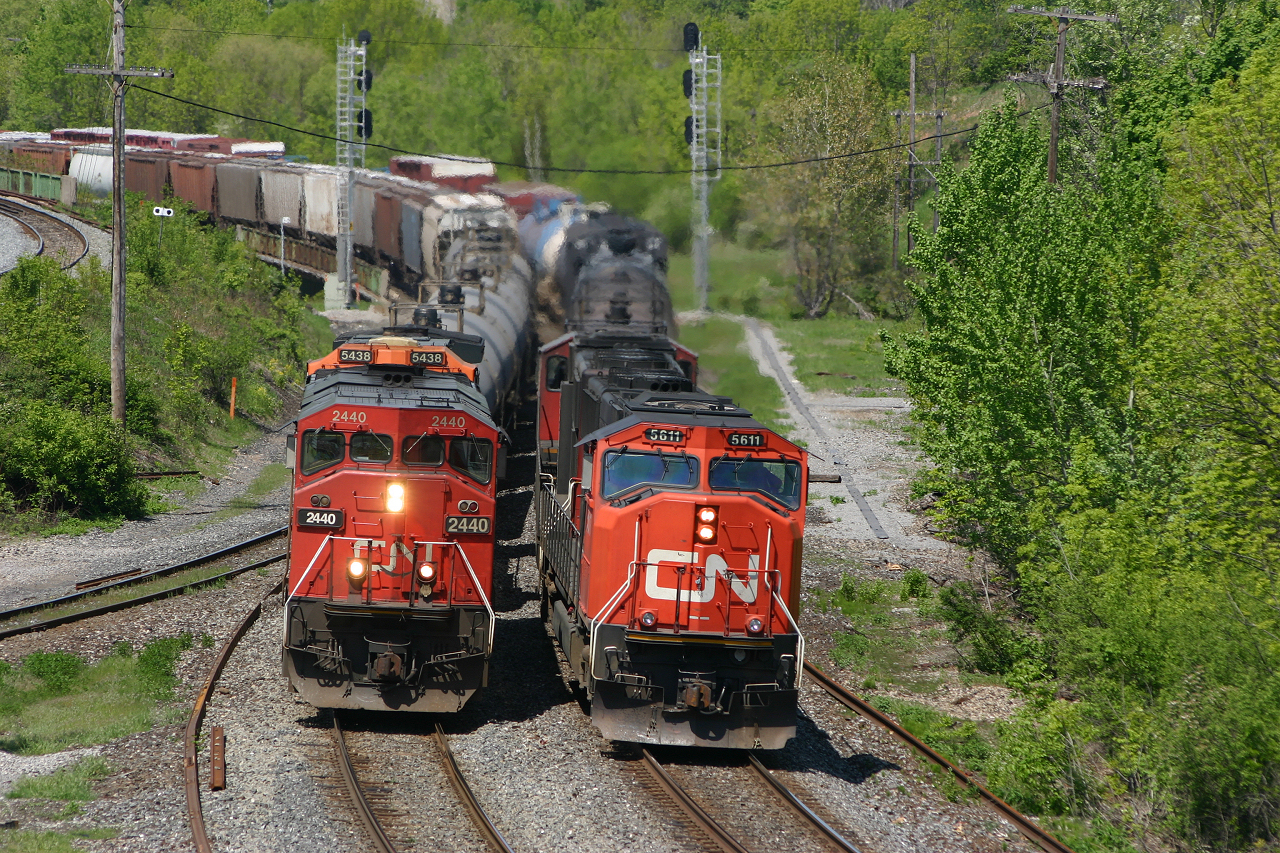 CN X392 led by 5611 rolls off the hill beside CN 394 - Sometimes things just come together!