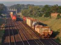 CN 2151 brings train X384 into Aldershot while the conductor of train 421 protects the rear movement of a cut of cars billed for Hamilton.