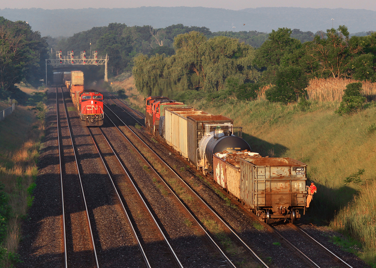 CN 2151 brings train X384 into Aldershot while the conductor of train 421 protects the rear movement of a cut of cars billed for Hamilton.