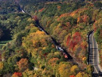 CN 2566 brings train 332 down the Niagara Escarpment at Mile 3 of the Dundas Subdivision around some spectacular fall colours.
