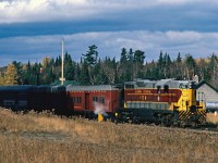 It is a cold windy day as No. 2 makes a station stop. Winter is coming on fast now and the fall colours are almost gone.