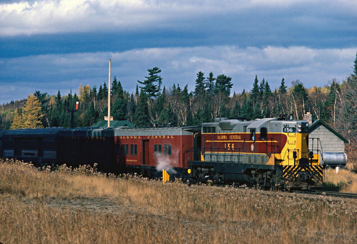 It is a cold windy day as No. 2 makes a station stop. Winter is coming on fast now and the fall colours are almost gone.