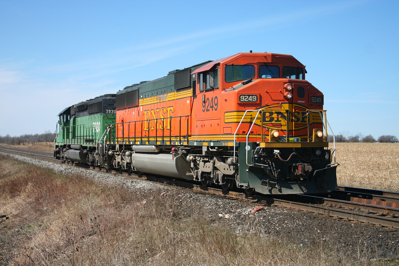 CN X397 rolls through the countryside of North Burlington with BNSF 9249 and BNSF 7930, to lift some hot cars from Aldershot.