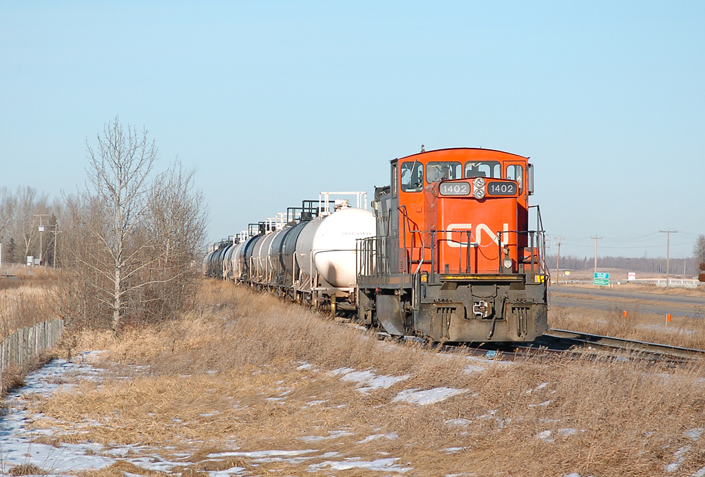 A GMD/CN GMD1u being stored on a side track on the section that connects CN's Vegreville sub to CP's Scotford sub at Scotford/Fort Saskatchewan. The front coupler appears to be non functional.