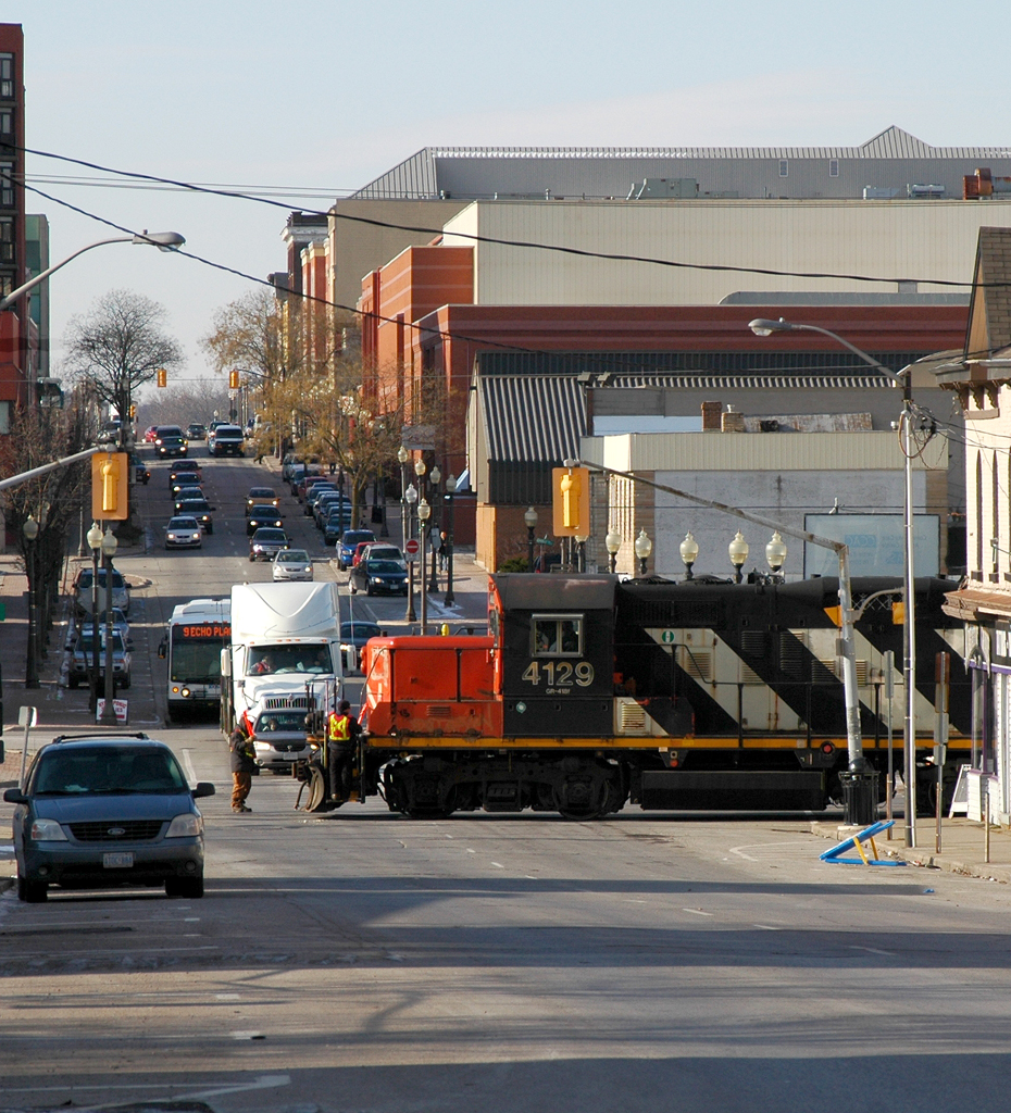 CN 4129 protected by it's crew enters Colborne street